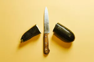 knife between parts of zucchini