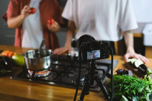 men filming cooking vlog